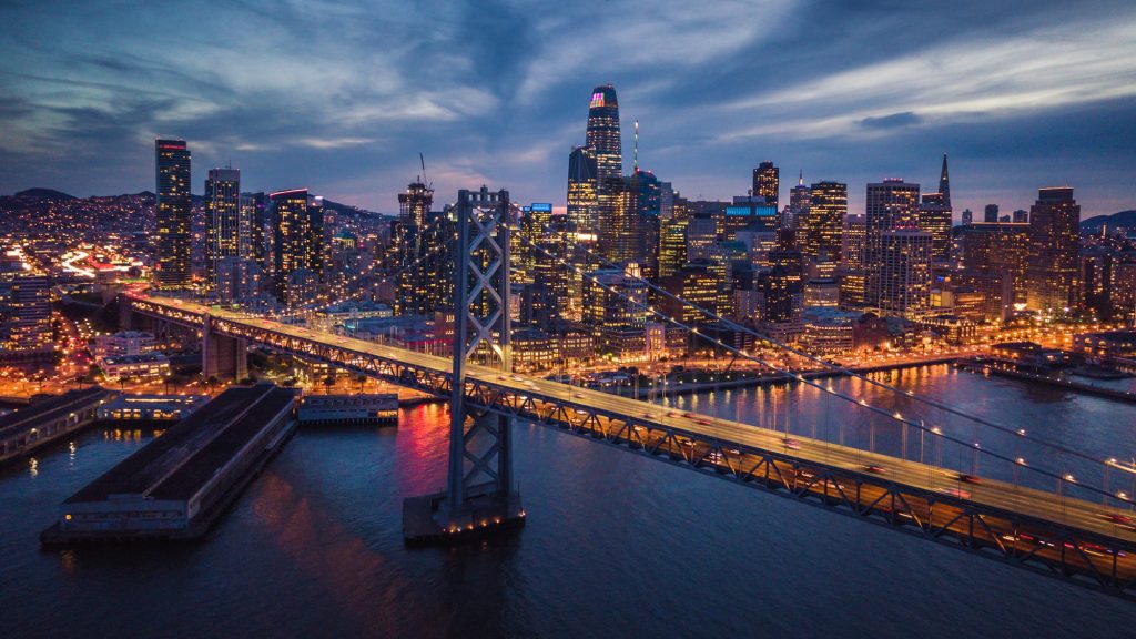 Aerial Cityscape view of San Francisco and the Bay Bridge at Nig