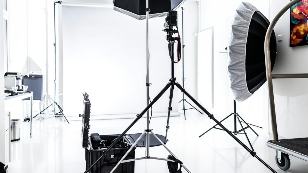 Beautiful shot of a photography studio with white lights and background