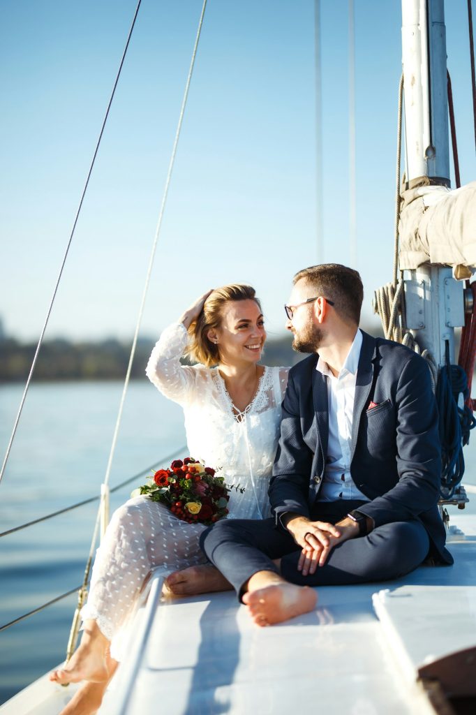 Beautiful wedding couple on yacht at wedding day outdoors in the sea. Together. Wedding day.