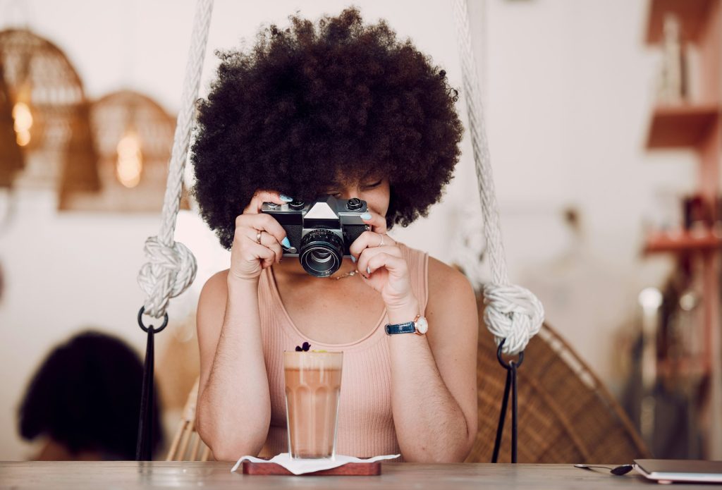 Camera, photography and woman in coffee shop for content marketing, drink advertising and menu upda