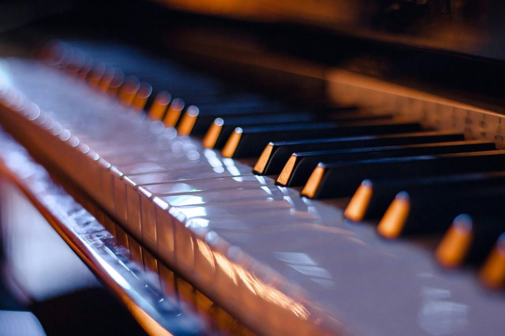 Close-up of piano keys, in the light of evening lights. Soft focus