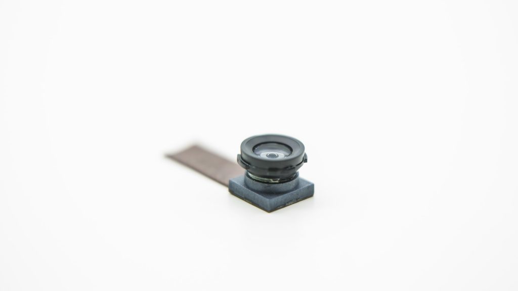 Close up on a camera module for mobile phone. Closeup of Smartphone Lens