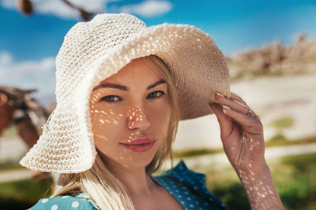 close-up portrait of a girl in a hat against the background of the landscape of cappadocia