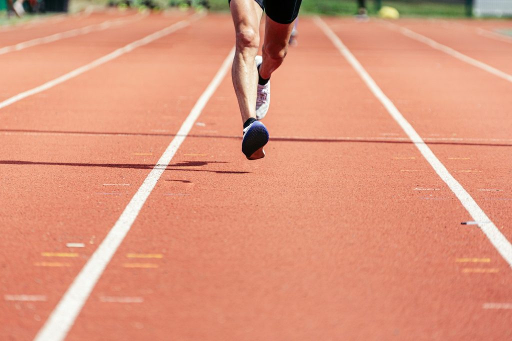 Front Close-up of the legs of a runner man.