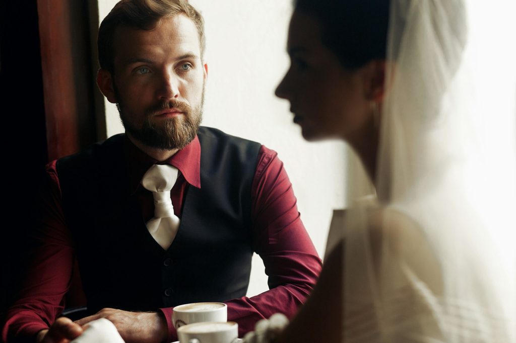 Groom looking at gently gorgeous bride in soft light