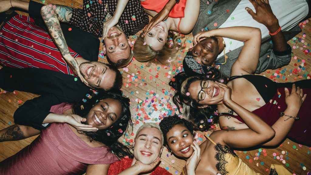 Group of friends lying on the floor at a party