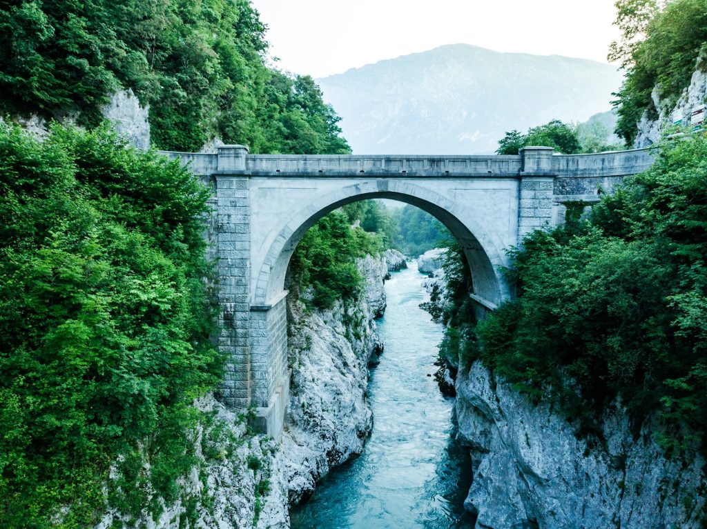 Napoleons Bridge over river Soca, Slovenia, aerial drone view