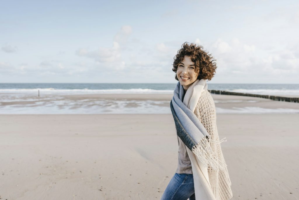 Portrait of happy woman on the beach