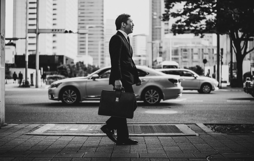 Senior business man moments on the streets of Tokyo