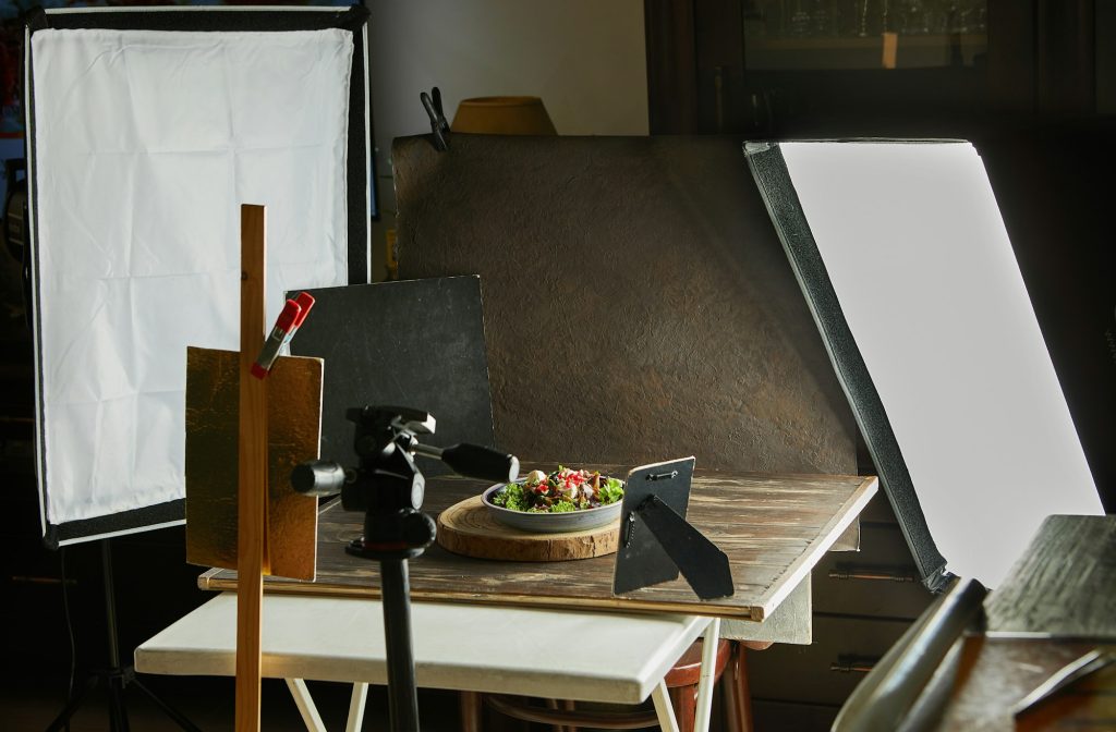 Set food photographer equipment for shooting recipes, softboxes and tripods, reflectors