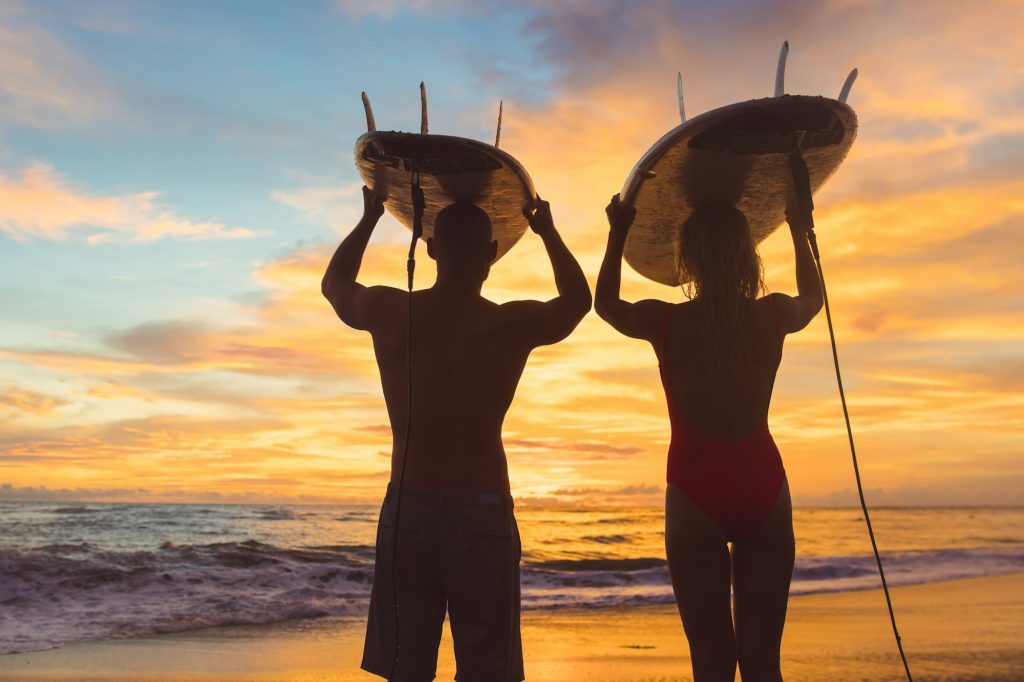 Sports couple at sunset