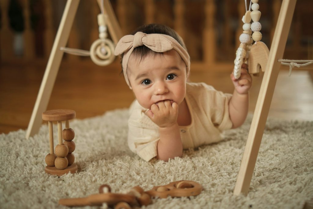 Summertime Serenity for Infants: A sunlit room sets the stage for a toddler on a beige mat, where