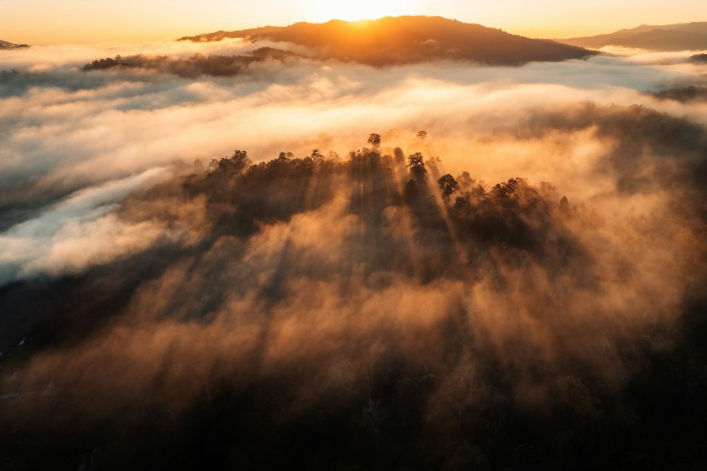 Sunrise above the fog ,Flying above the clouds sunrise and fog