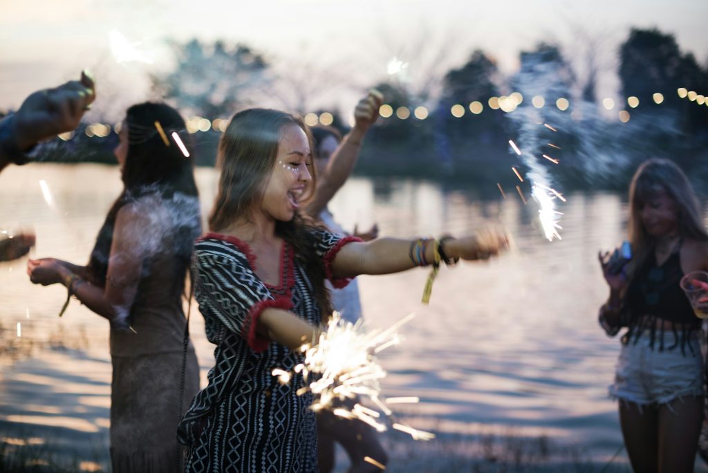 Woman Enjoying Sparkler in Festival Event