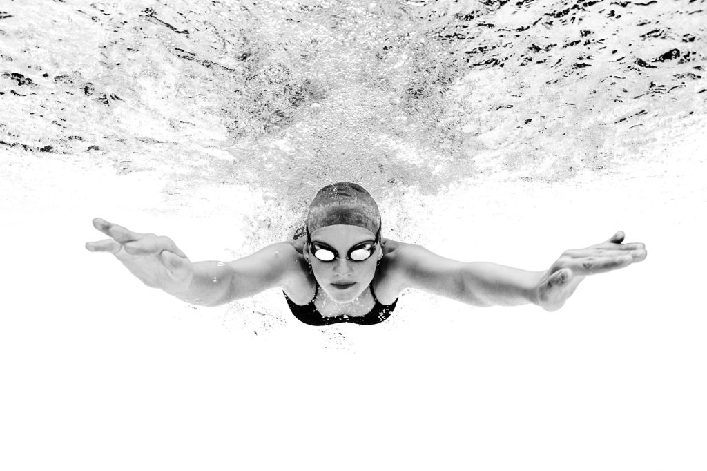 Young woman swimming underwater